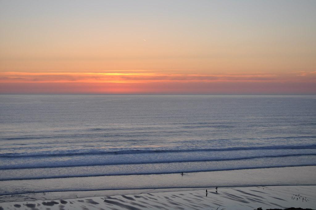 Newquay harbour with boats at low tide